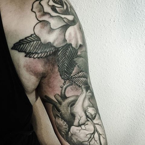 heart and flowers arm tattoo