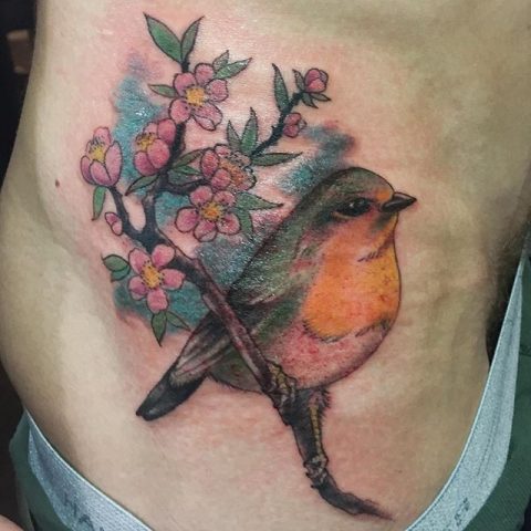 bird and flowers tattoo