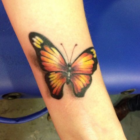 butterfly arm tattoo