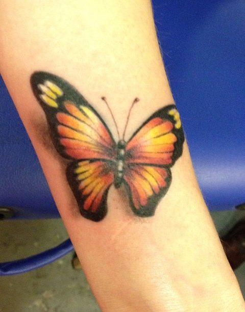 butterfly arm tattoo