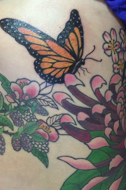 butterfly and flowers tattoo