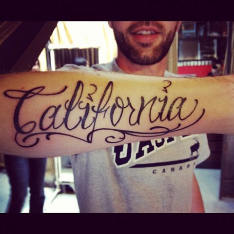 California script tattoo