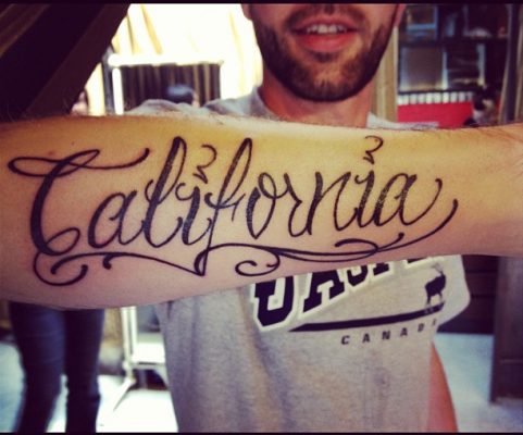 California script tattoo