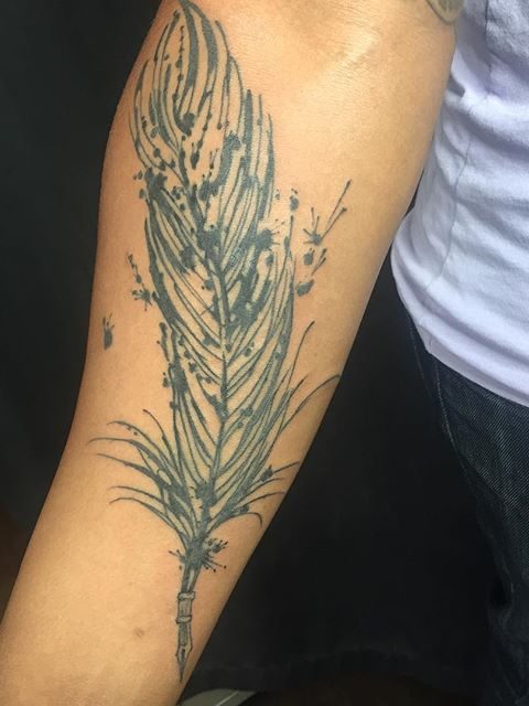 forearm feather tattoo