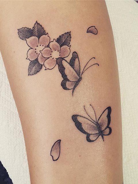 simple flowers and butterflies tattoo
