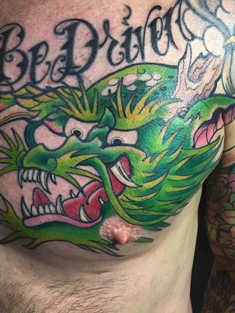 green chest dragon tattoo