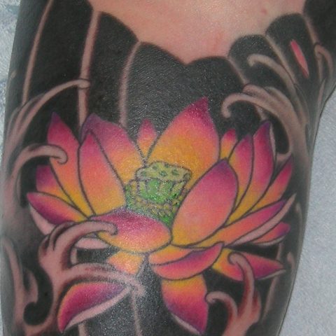 inner arm lotus tattoo