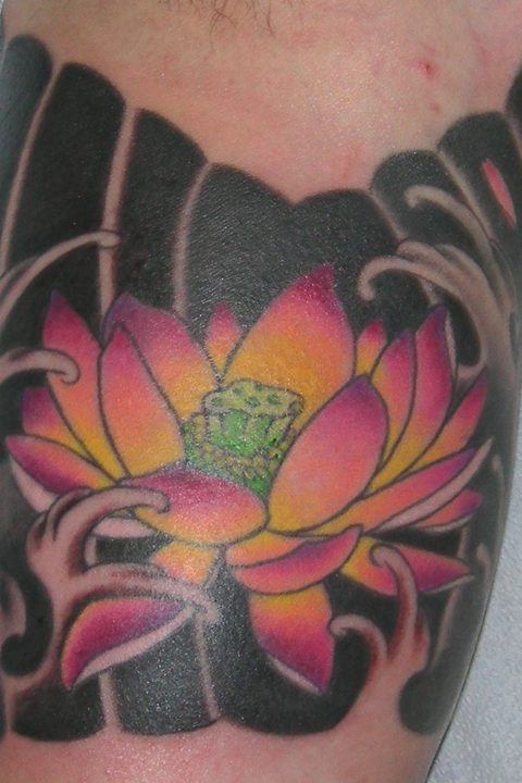 inner arm lotus tattoo