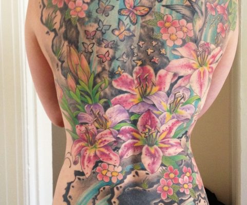 flower backpiece tattoo