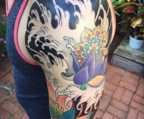 mandala waves flowers sleeve tattoo