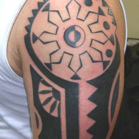Polynesian quarter sleeve tattoo