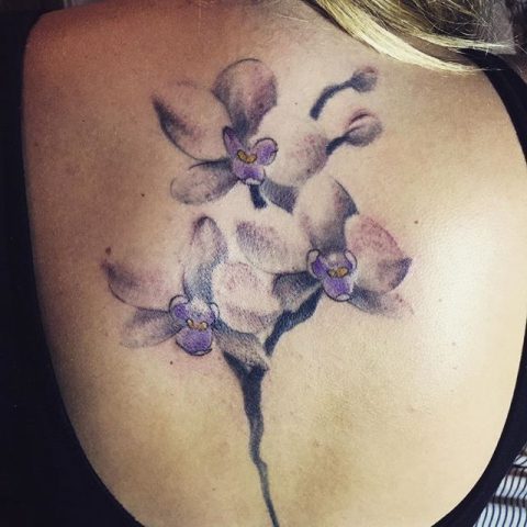 purple watercolor flowers tattoo