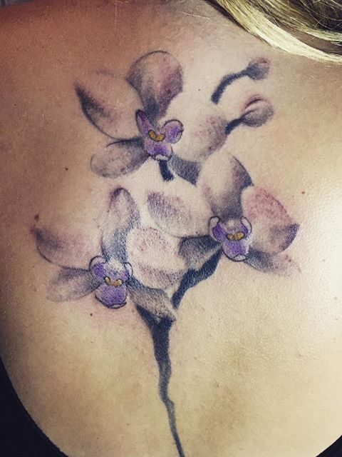 purple watercolor flowers tattoo