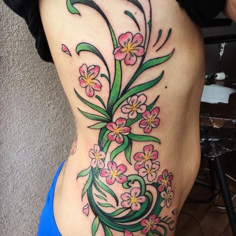 rib flowers tattoo