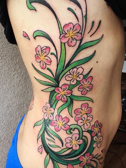 rib flowers tattoo