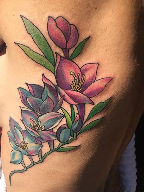 rib flowers tattoo