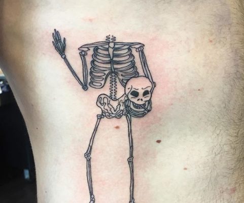skeleton holding head tattoo
