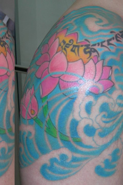 Tibetan shoulder and waves shoulder chest tattoo