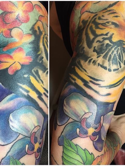 tiger and flowers sleeve tattoo
