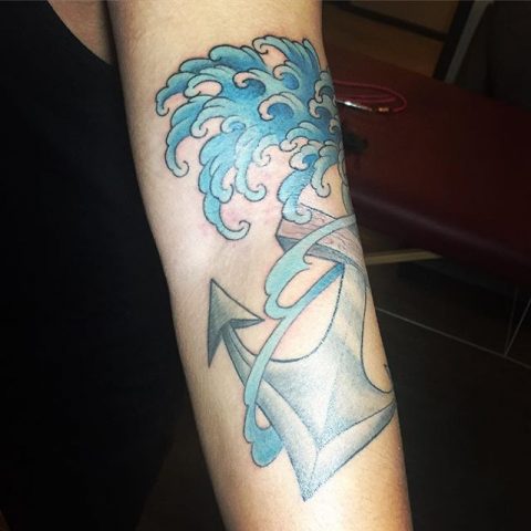 waves and anchor tattoo