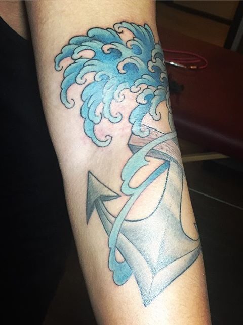 waves and anchor tattoo