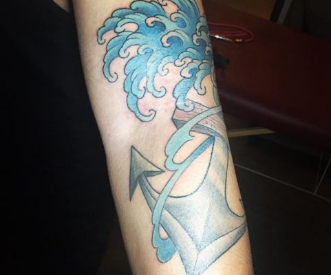 waves and anchor tattoo