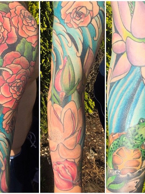 flowers waves turtle sleeve tattoo