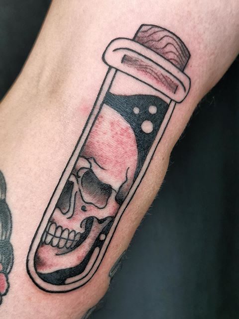 skull test tube tattoo