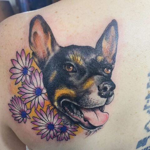 dog flowers tattoo
