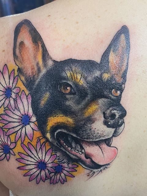 dog flowers tattoo
