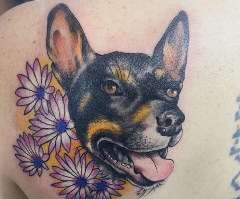 dog flowers tattoo