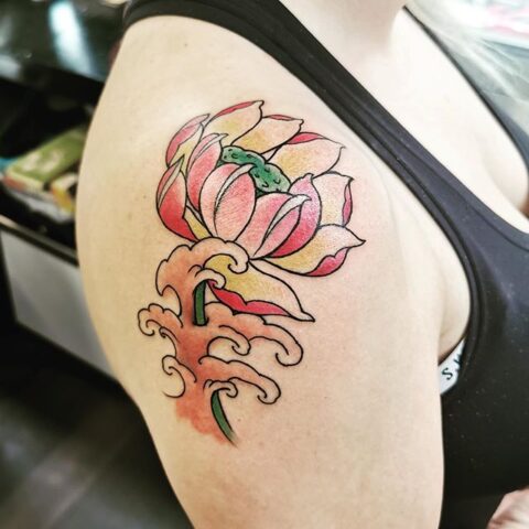 flower waves shoulder tattoo