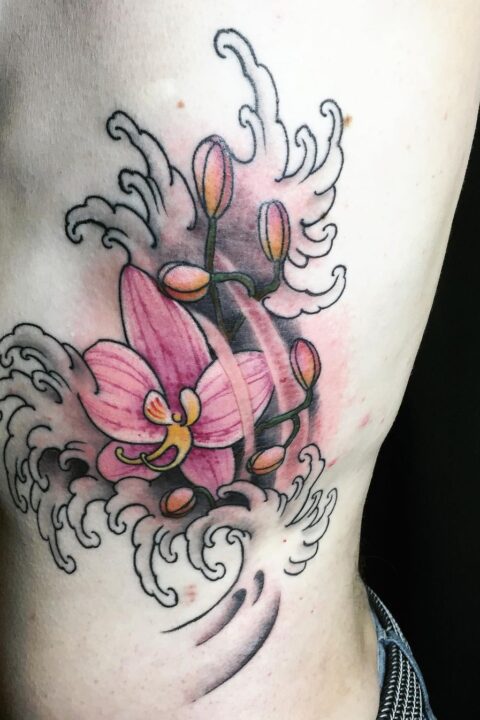 Flower Waves Rib Tattoo